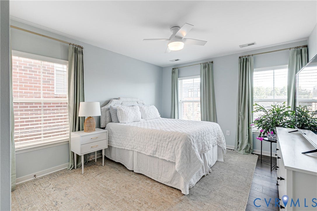 1733 W Cary Street, Richmond, VA 23220 Bedroom 2 with a ceiling fan and multiple windows with blinds