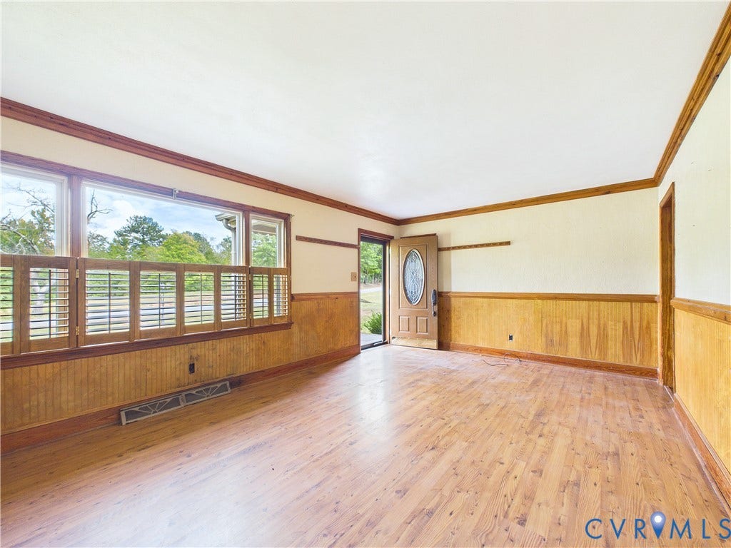 Wood-finish flooring with wood paneling and trim