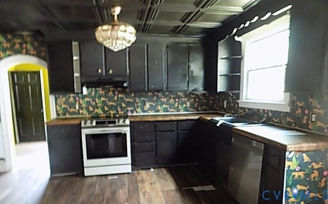 212 Royal Oak Avenue, Riverside Park, Colonial Heights, VA 23834 Kitchen featuring black cabinetry, a stainless steel range, a stainless steel dishwasher, wood-finish countertops, and wood-finish flooring