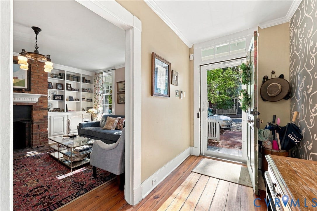 Hardwood flooring throughout the entry and living area