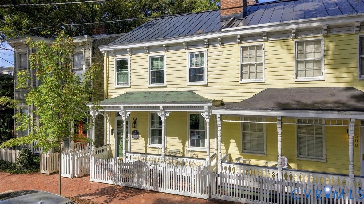 Yellow siding exterior with white trim