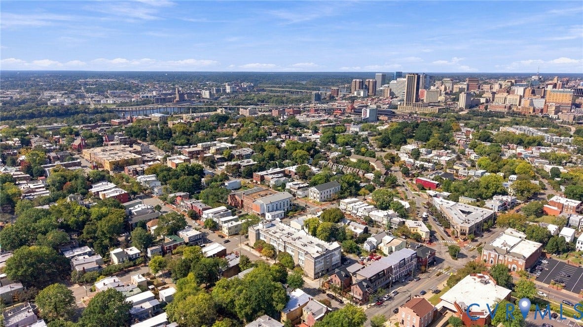 Expansive urban landscape featuring a mix of residential structures and commercial buildings