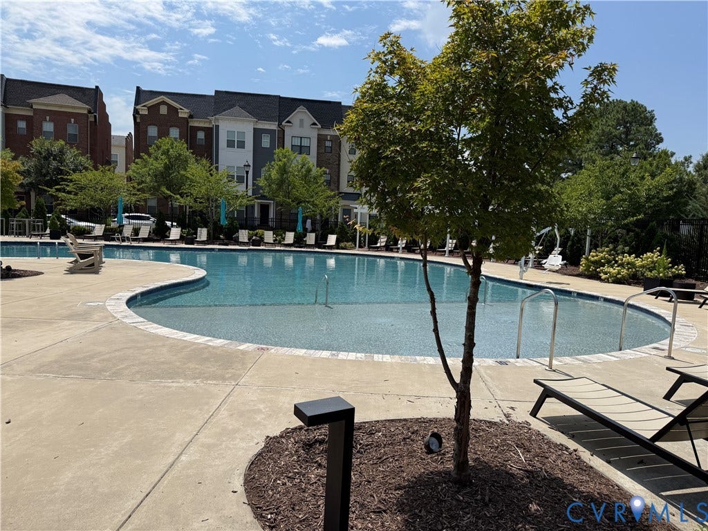 3931 Liesfeld Place, West Broad Village, Henrico, VA 23060 Curved swimming pool with concrete decking and landscaping