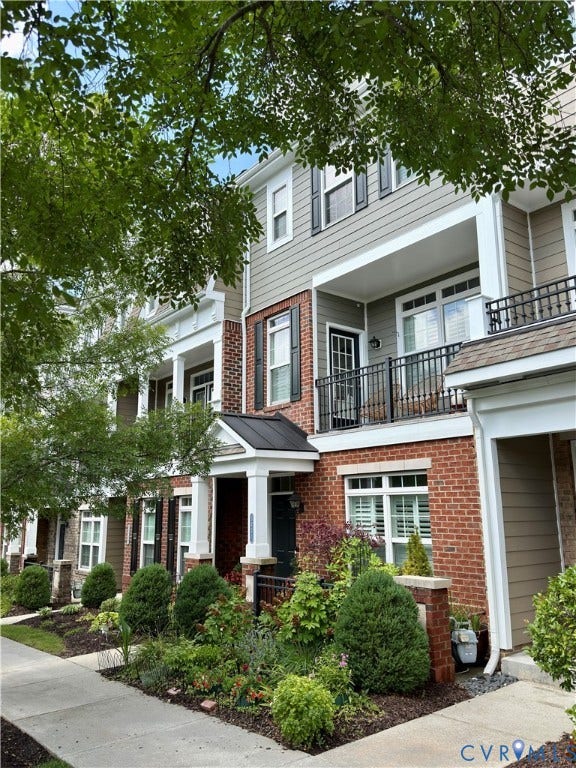 3931 Liesfeld Place, West Broad Village, Henrico, VA 23060 Townhome exterior featuring a brick facade, gray siding, and black window shutters