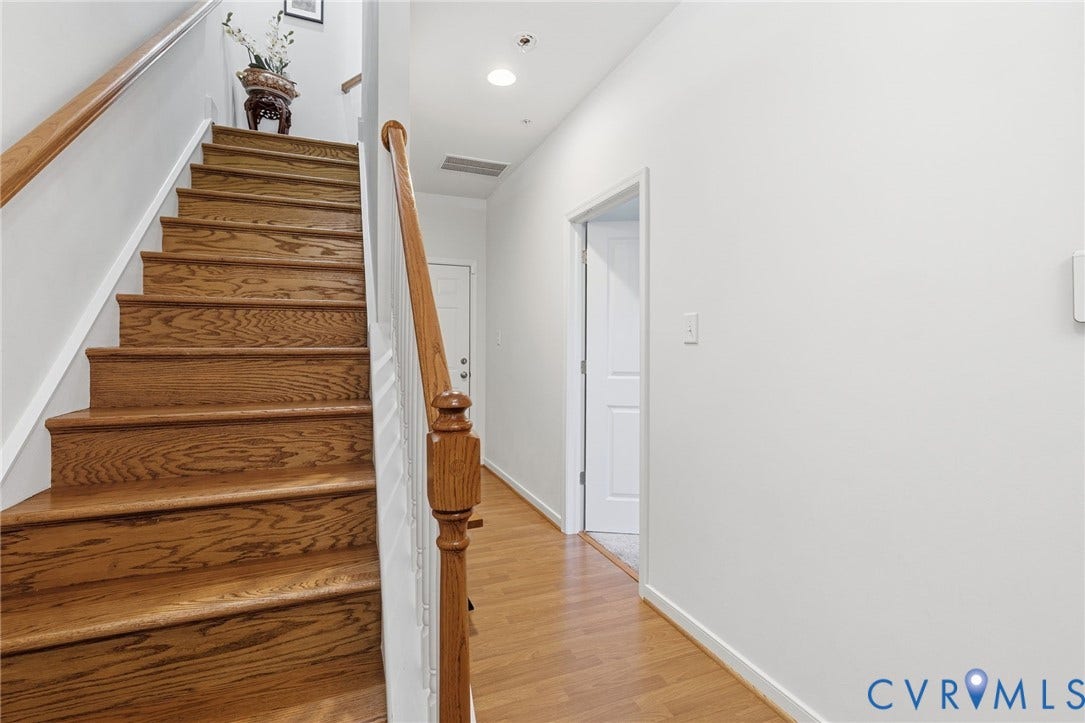 3931 Liesfeld Place, West Broad Village, Henrico, VA 23060 Wood-finish flooring throughout, complemented by a staircase with wood treads and a coordinating wood handrail