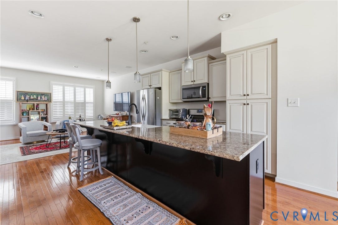 3931 Liesfeld Place, West Broad Village, Henrico, VA 23060 Spacious kitchen featuring a large island with a stone countertop, light-toned cabinetry, stainless steel appliances, and recessed lighting