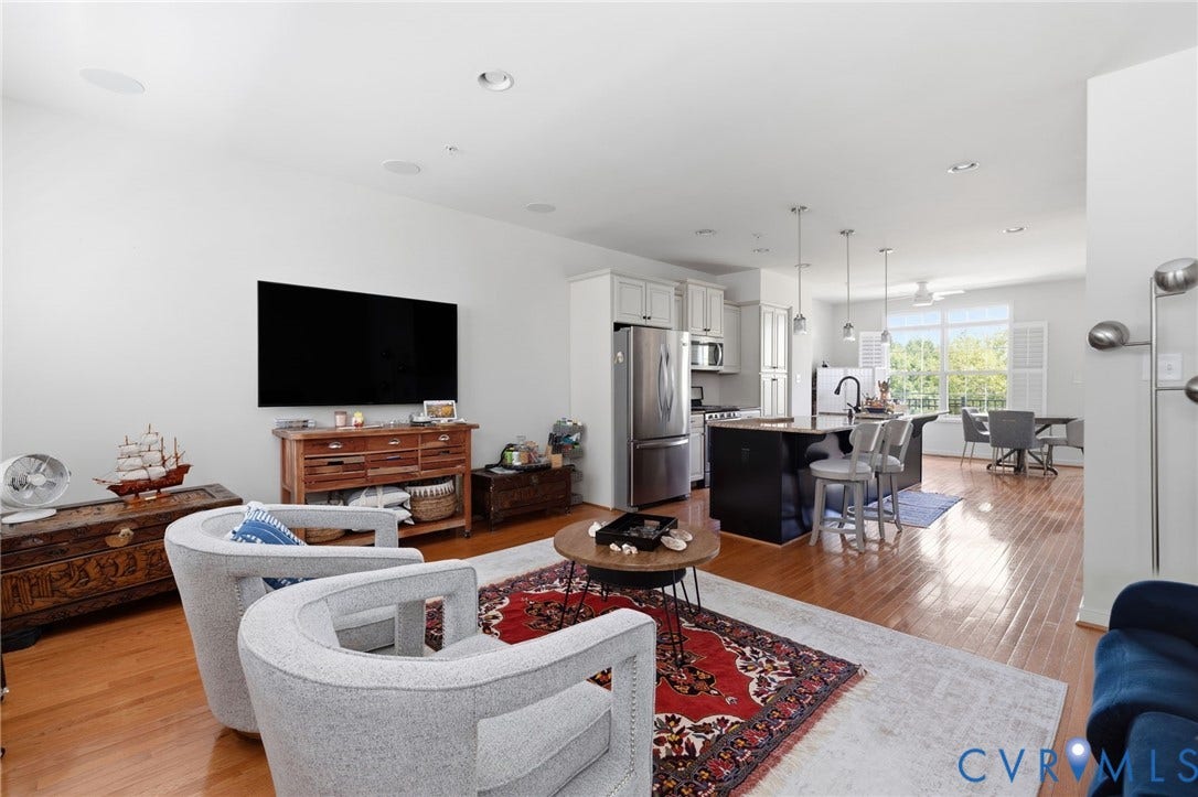 3931 Liesfeld Place, West Broad Village, Henrico, VA 23060 Hardwood flooring throughout, featuring an open-concept layout with recessed lighting, a kitchen island with pendant lighting, and stainless steel appliances