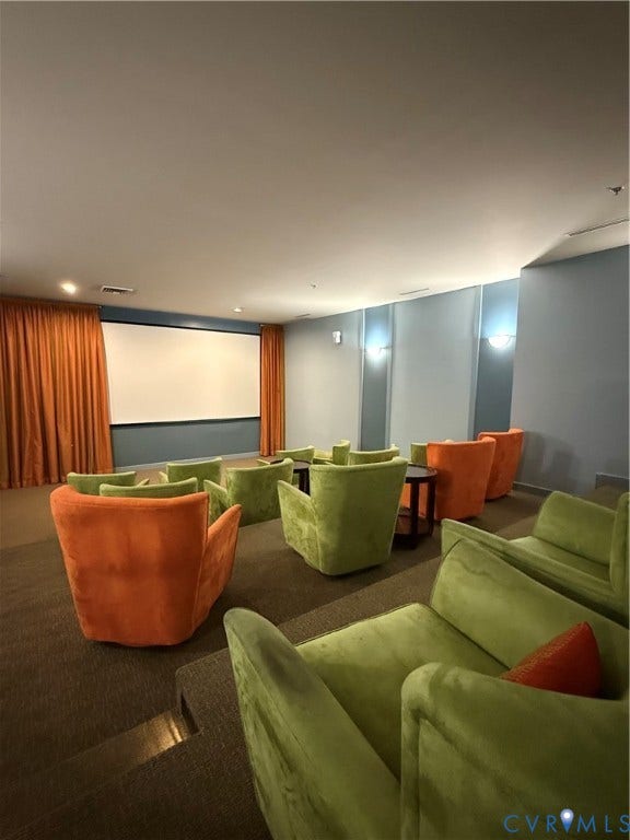 3931 Liesfeld Place, West Broad Village, Henrico, VA 23060 Tiered seating with plush upholstered chairs, projection screen, and wall sconce lighting