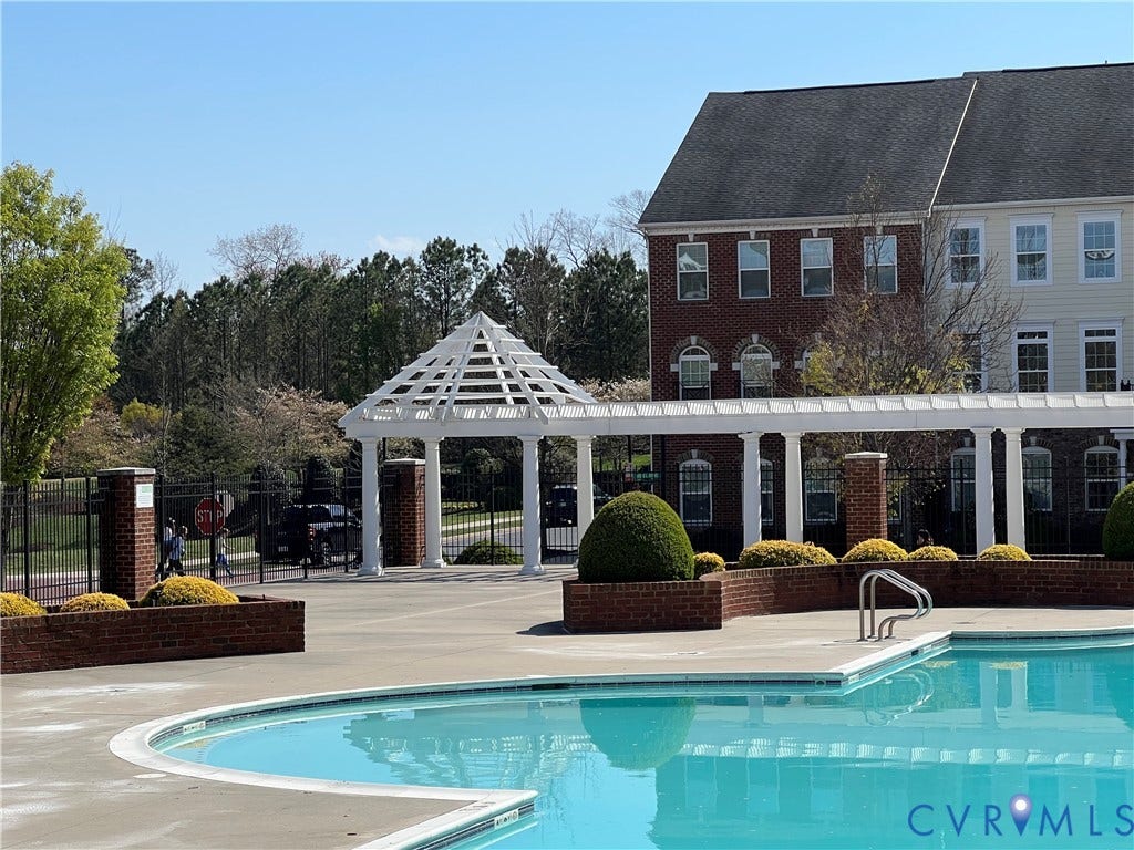 3931 Liesfeld Place, West Broad Village, Henrico, VA 23060 Swimming pool with curved edge, white pergola, brick accents, and mature landscaping