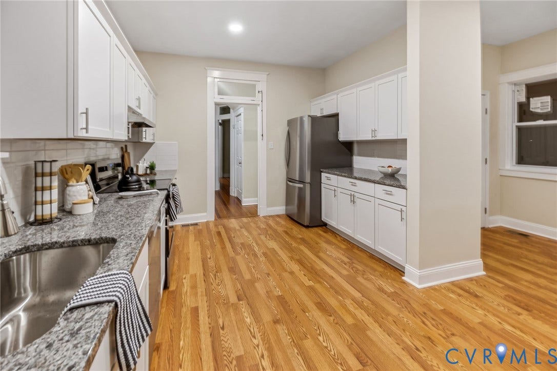 12105 Mathenay Drive, Mathenay, Chesterfield, VA 23831 Wood-finish flooring, white cabinetry with brushed nickel hardware, and grey speckled countertops
