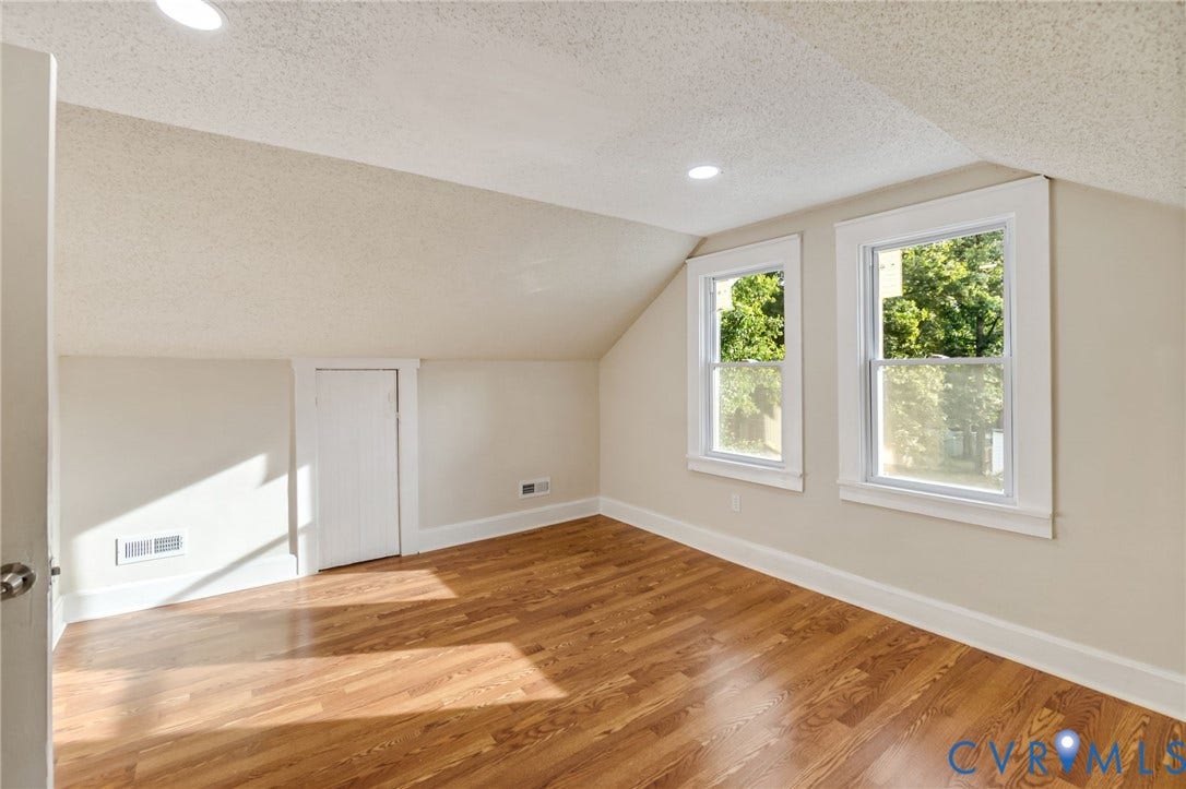 12105 Mathenay Drive, Mathenay, Chesterfield, VA 23831 Sloped ceiling design, two double-hung windows, recessed lighting, and wood-finish flooring