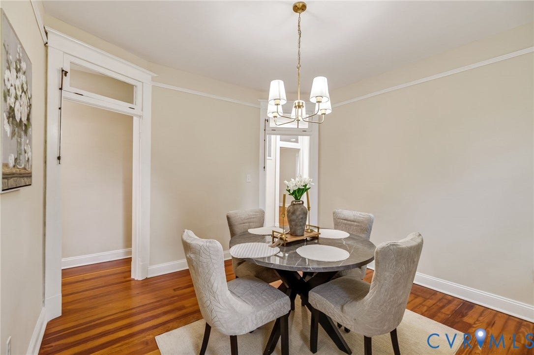 12105 Mathenay Drive, Mathenay, Chesterfield, VA 23831 Hardwood flooring, crown molding, white trim, and a gold-finish chandelier