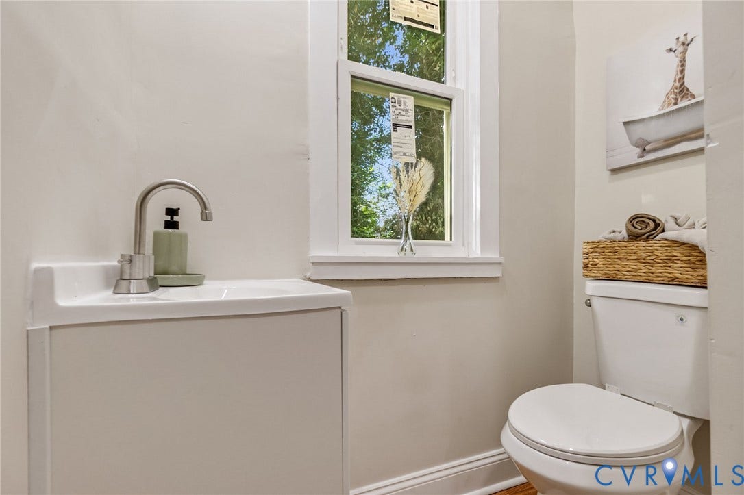 12105 Mathenay Drive, Mathenay, Chesterfield, VA 23831 White vanity with integrated sink, gooseneck faucet, window, and toilet