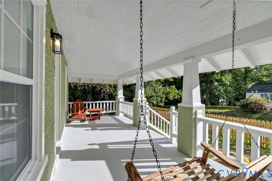 12105 Mathenay Drive, Mathenay, Chesterfield, VA 23831 Expansive covered porch with white railing, light green siding, and a ceiling-mounted light fixture