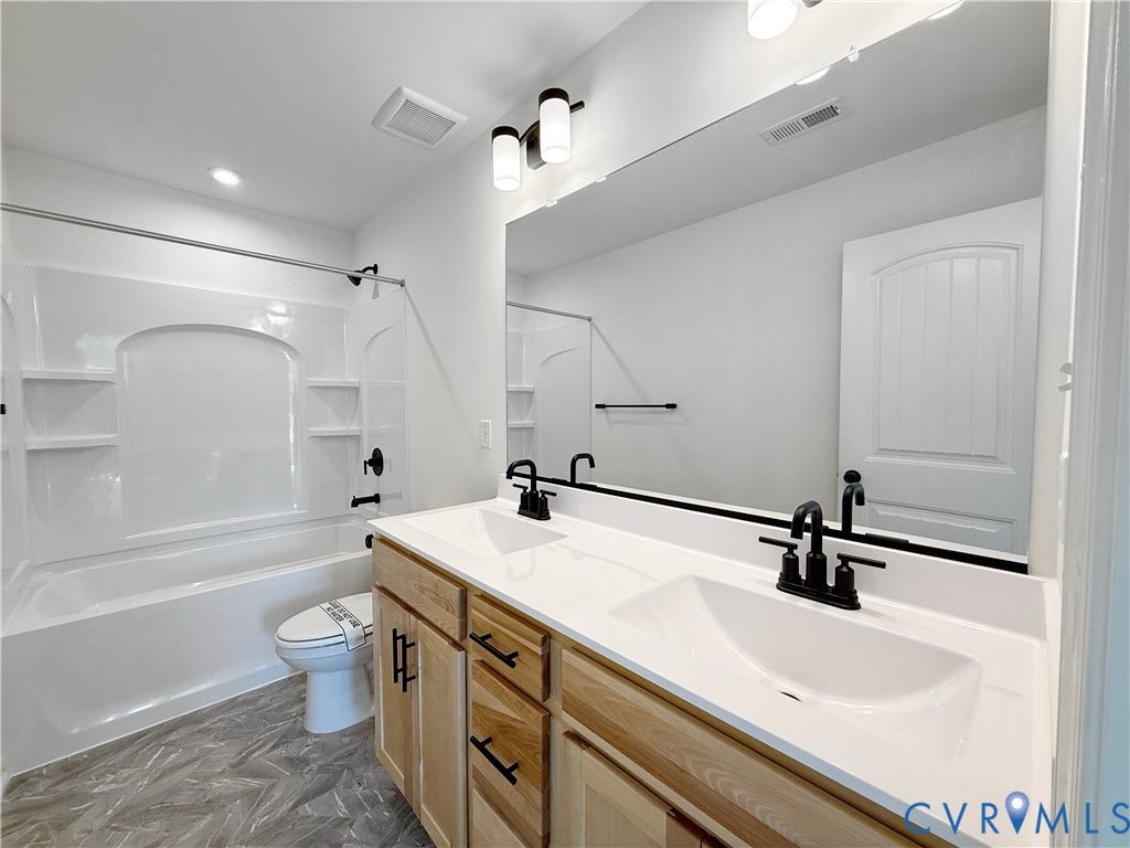 This home is UNDER CONSTRUCTION. The photo represents the plan, not the actual home. Design selections have been made.