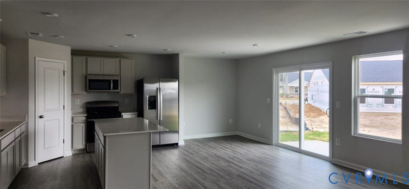 321 Camerons Ferry Drive, Glen Allen, VA 23060 Open-concept layout featuring wood-finish flooring, a kitchen island, and stainless steel appliances