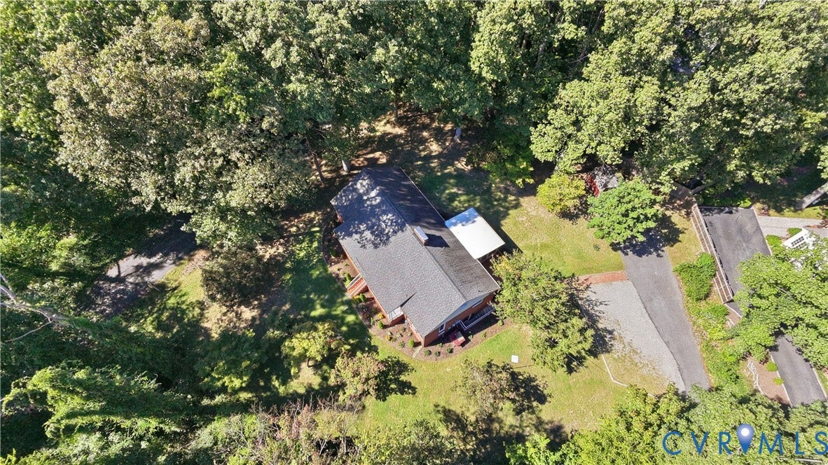 Pitched roof structure with dark shingles