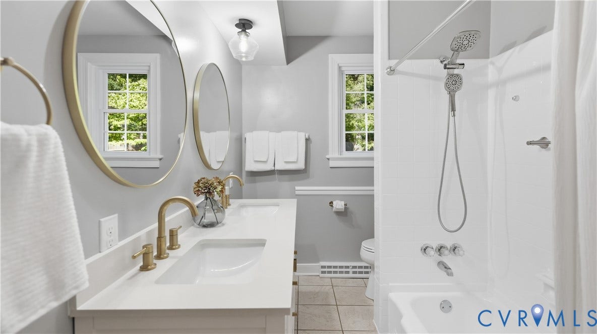 Dual vanity with gold-finish fixtures and hardware