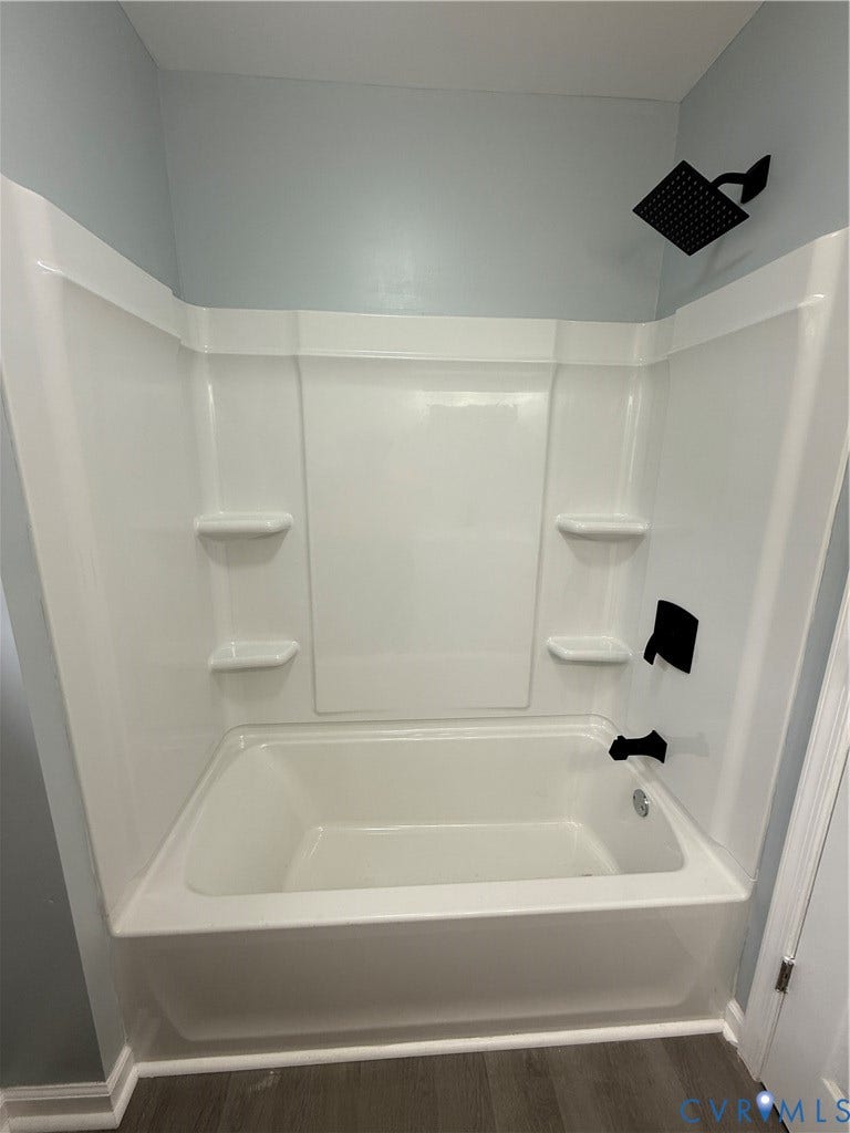 129 S Old Church Street, Petersburg, VA 23803 Bathroom featuring wood-type flooring and tub / shower combination