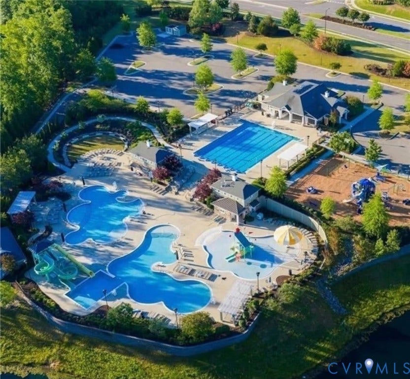 7319 Vicenzo Drive, Moseley, VA 23120 Community amenity area featuring multiple swimming pools, a dedicated lap pool, water slides, a clubhouse, and a playground