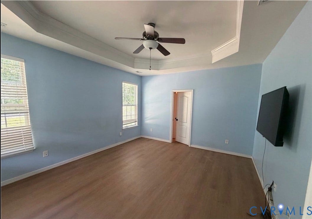 7319 Vicenzo Drive, Moseley, VA 23120 Tray ceiling with crown molding, wood-finish flooring, ceiling fan, and multiple windows