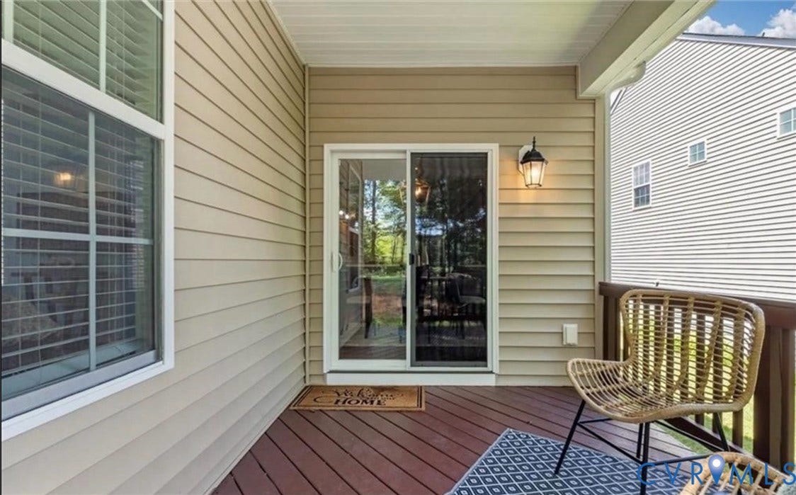 7319 Vicenzo Drive, Moseley, VA 23120 Covered porch featuring siding exterior, sliding glass door entry, and dark wood-finish decking