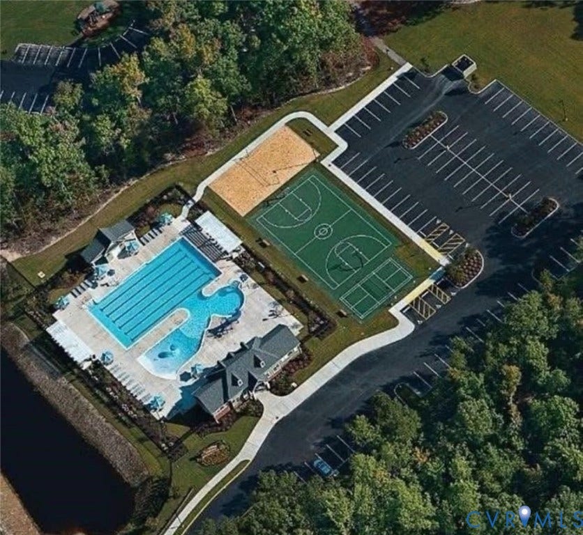 7319 Vicenzo Drive, Moseley, VA 23120 Expansive outdoor pool area with multiple swimming pools, sports court, sand volleyball court, and ample surface parking