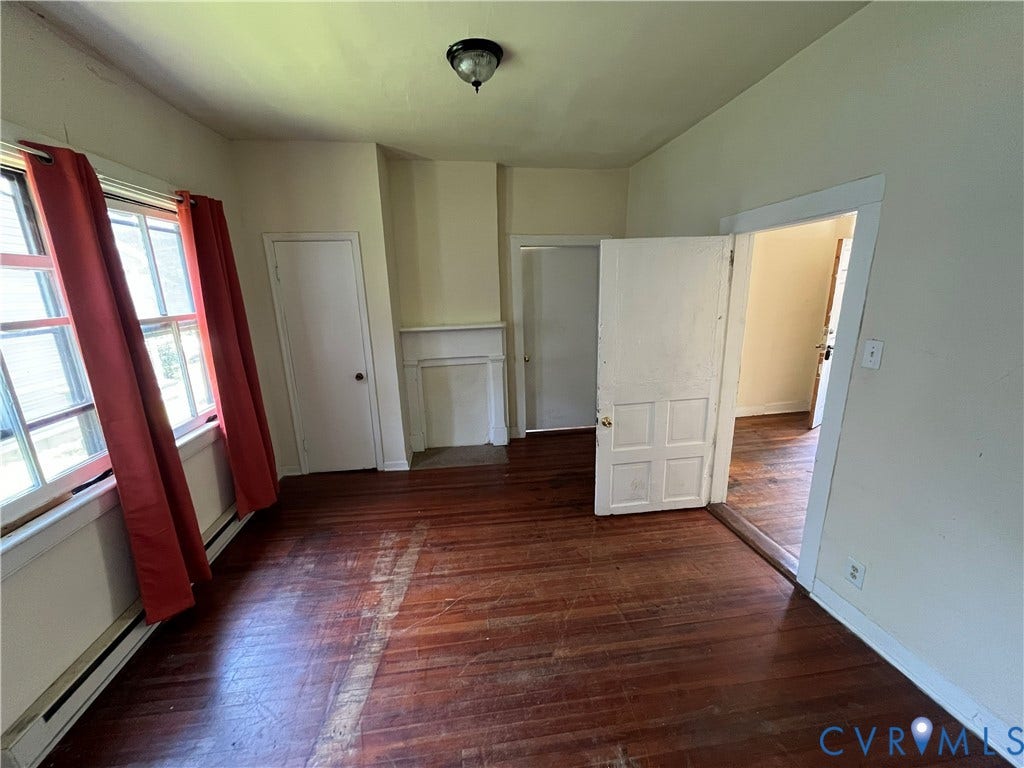 927 Farmer Street, Petersburg, VA 23803 Hardwood flooring, multiple windows, built-in wall niche, ceiling-mounted light fixture, and classic panel doors