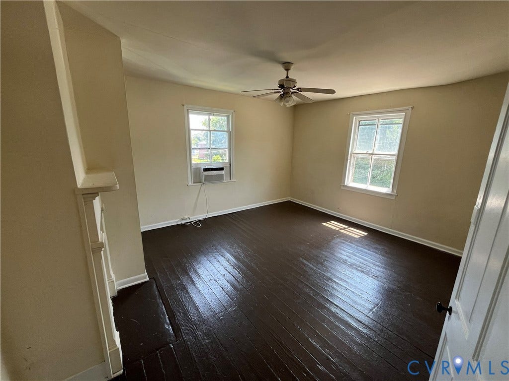 927 Farmer Street, Petersburg, VA 23803 Hardwood flooring, painted walls, two windows, and a ceiling fan with integrated lighting