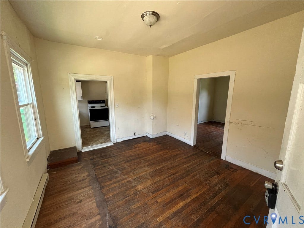 927 Farmer Street, Petersburg, VA 23803 Hardwood flooring, natural light through a window, and a ceiling-mounted light fixture