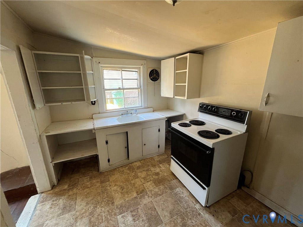 927 Farmer Street, Petersburg, VA 23803 Kitchen featuring a window, built-in cabinetry, an electric range, and resilient flooring