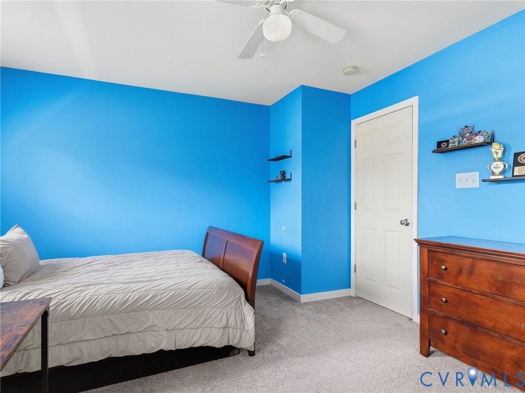 13925 Gorham Lane, Charter Colony, Midlothian, VA 23114 Wall-to-wall carpeting, a white paneled door, and a ceiling fan are featured in this room