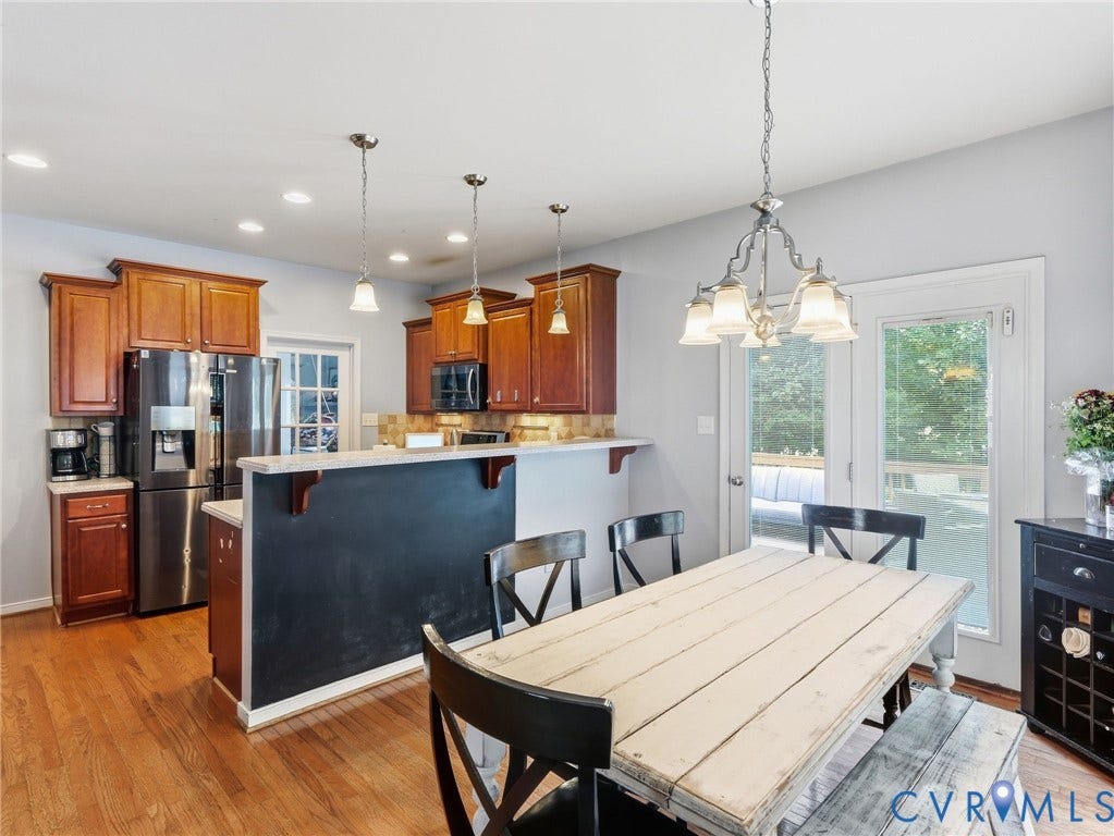 13925 Gorham Lane, Charter Colony, Midlothian, VA 23114 Hardwood flooring, wood cabinetry, stainless steel appliances, recessed lighting, and patio doors