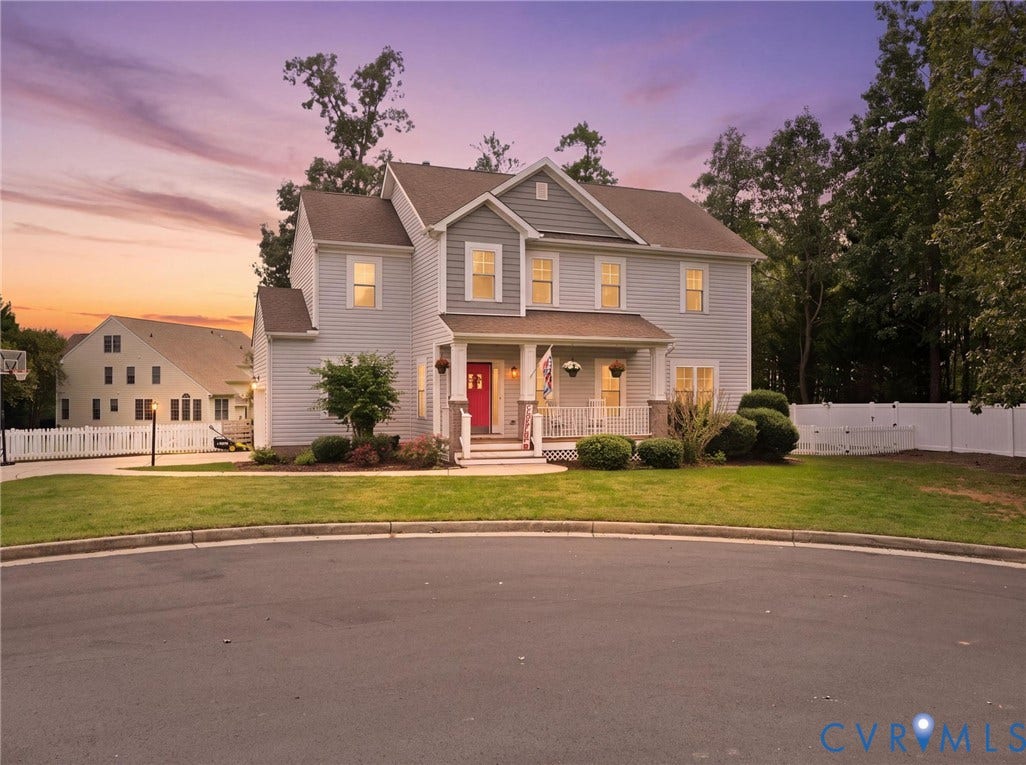 13925 Gorham Lane, Charter Colony, Midlothian, VA 23114 Two-story residence featuring light-colored siding, a covered front porch, and an attached garage