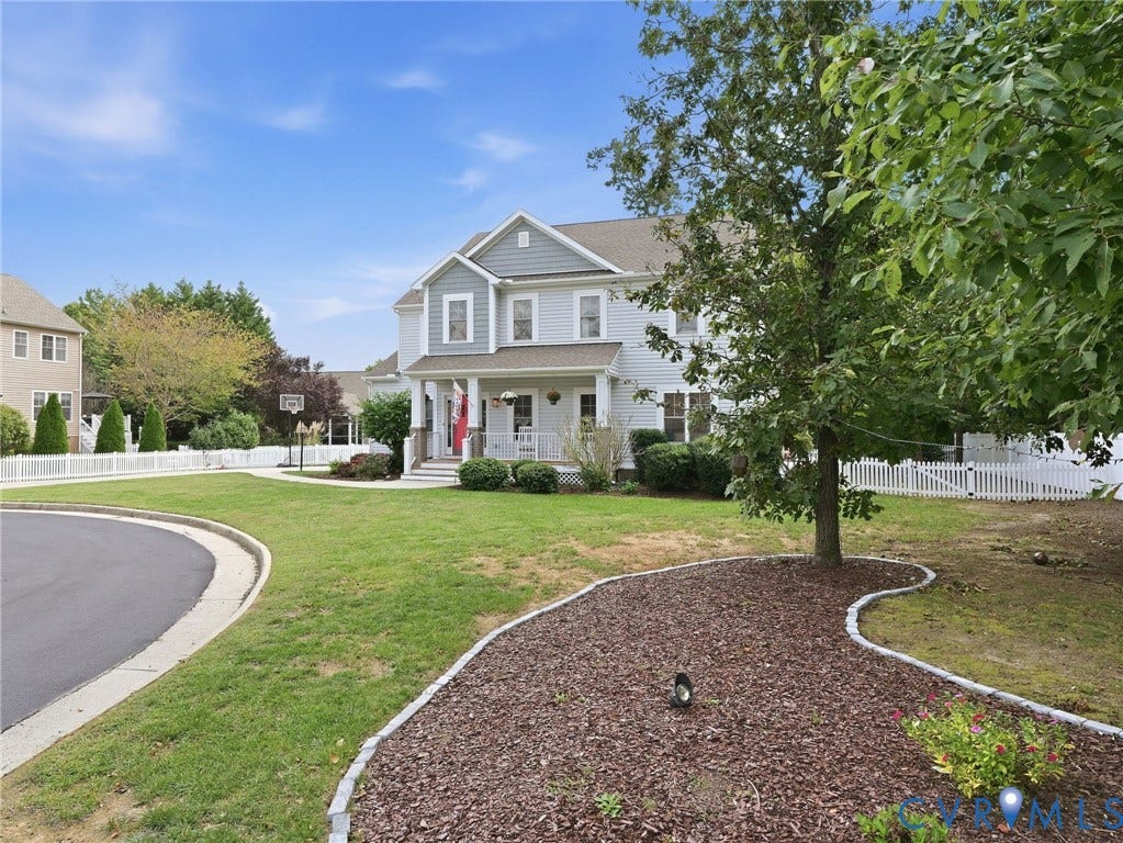 13925 Gorham Lane, Charter Colony, Midlothian, VA 23114 Two-story residence with light siding and contrasting architectural shingle accents