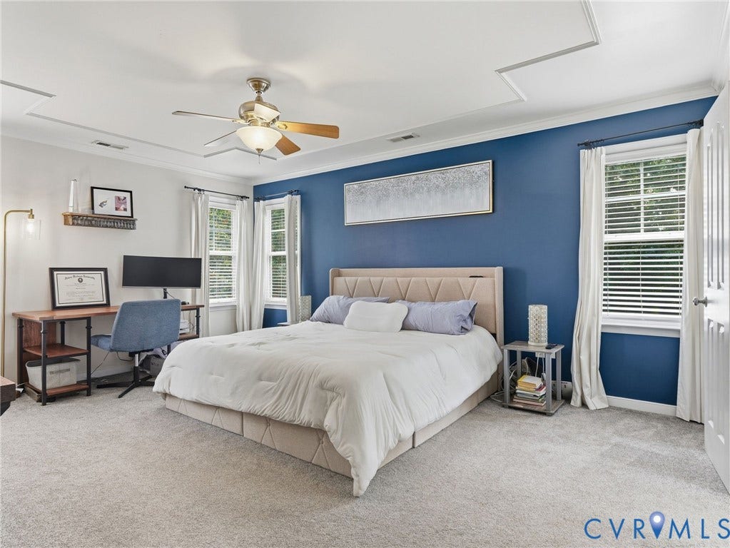 13925 Gorham Lane, Charter Colony, Midlothian, VA 23114 Tray ceiling with crown molding, ceiling fan, accent wall, two windows with blinds, and light-toned carpeting