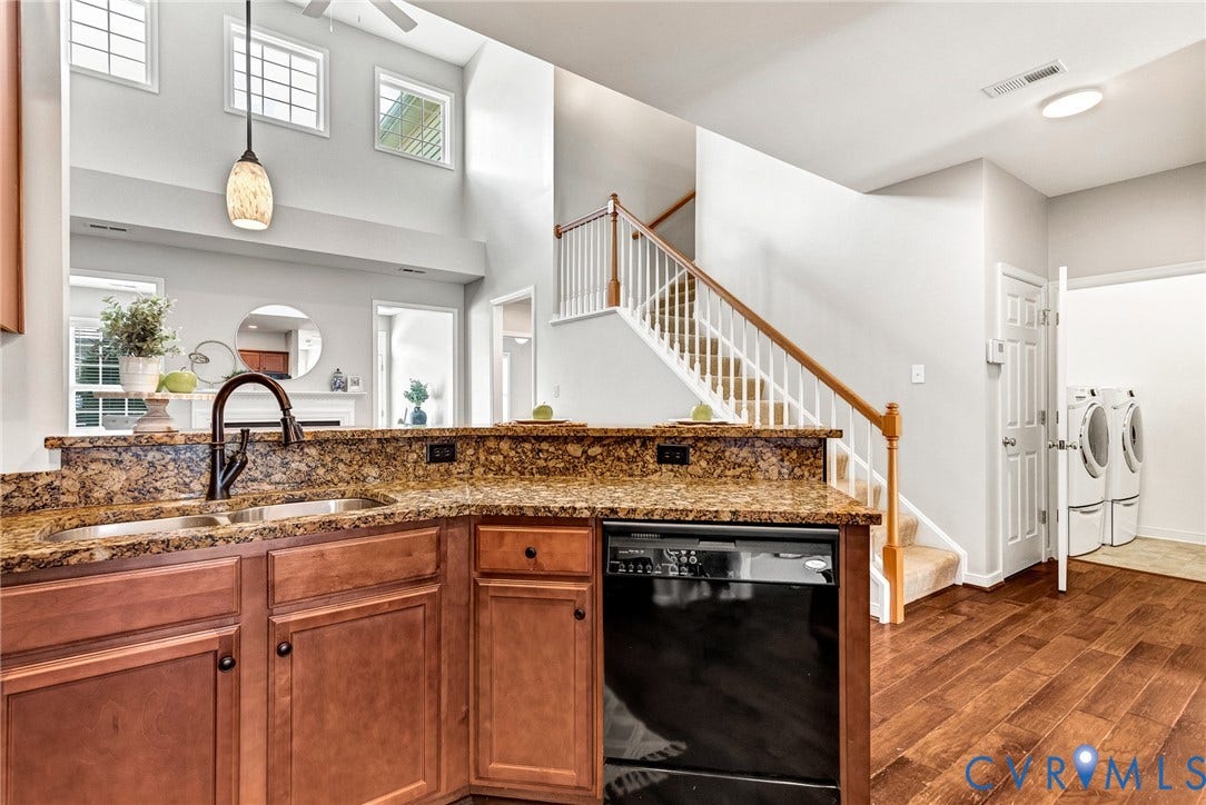7728 Marshall Arch Drive, Liberty Trace, Mechanicsville, VA 23111 Kitchen featuring a double basin sink with a gooseneck faucet, integrated dishwasher, and wood cabinetry