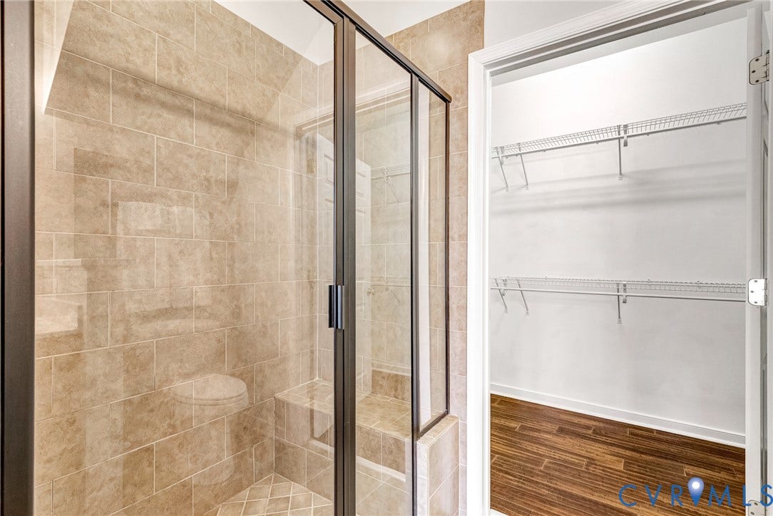 7728 Marshall Arch Drive, Liberty Trace, Mechanicsville, VA 23111 Tiled shower enclosure with a built-in bench and glass door