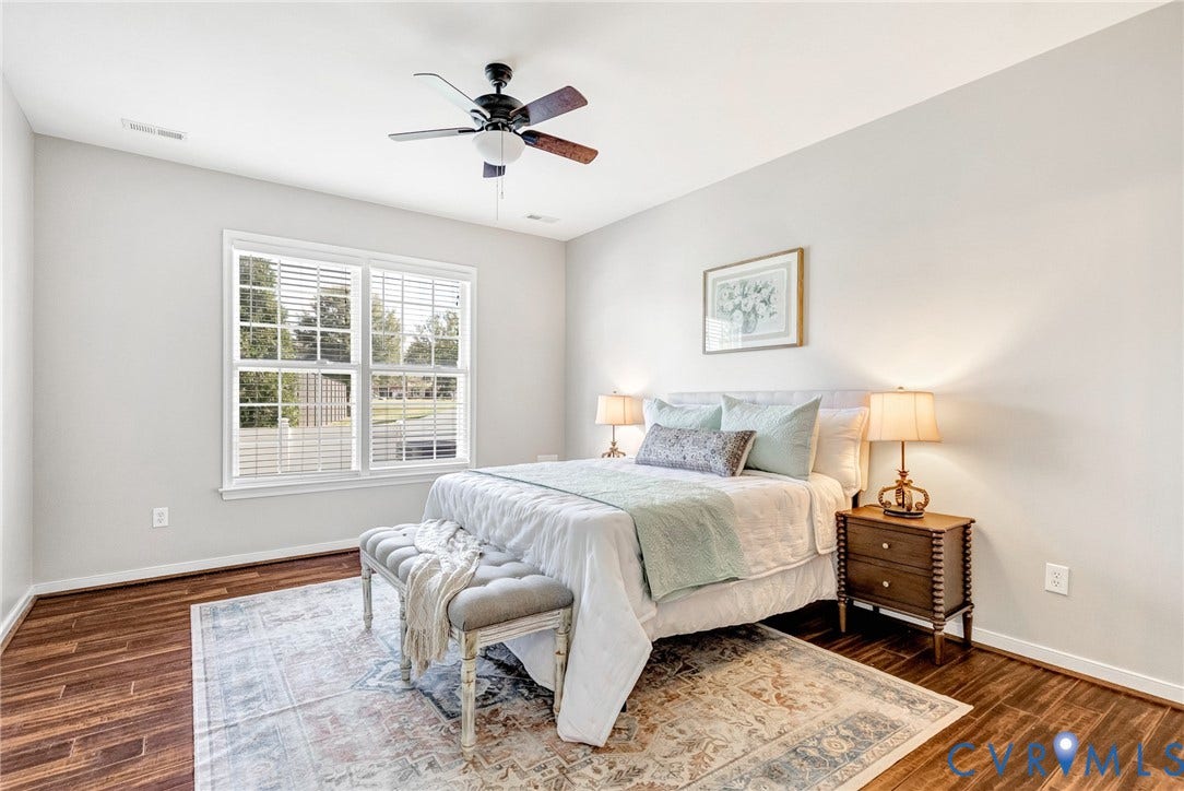 7728 Marshall Arch Drive, Liberty Trace, Mechanicsville, VA 23111 Wood-finish flooring, white walls, and a ceiling fan with integrated lighting