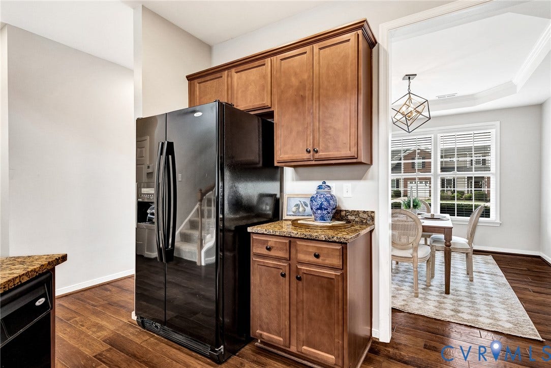 7728 Marshall Arch Drive, Liberty Trace, Mechanicsville, VA 23111 Hardwood-style flooring throughout, full-size refrigerator, built-in cabinetry, and granite-style countertops
