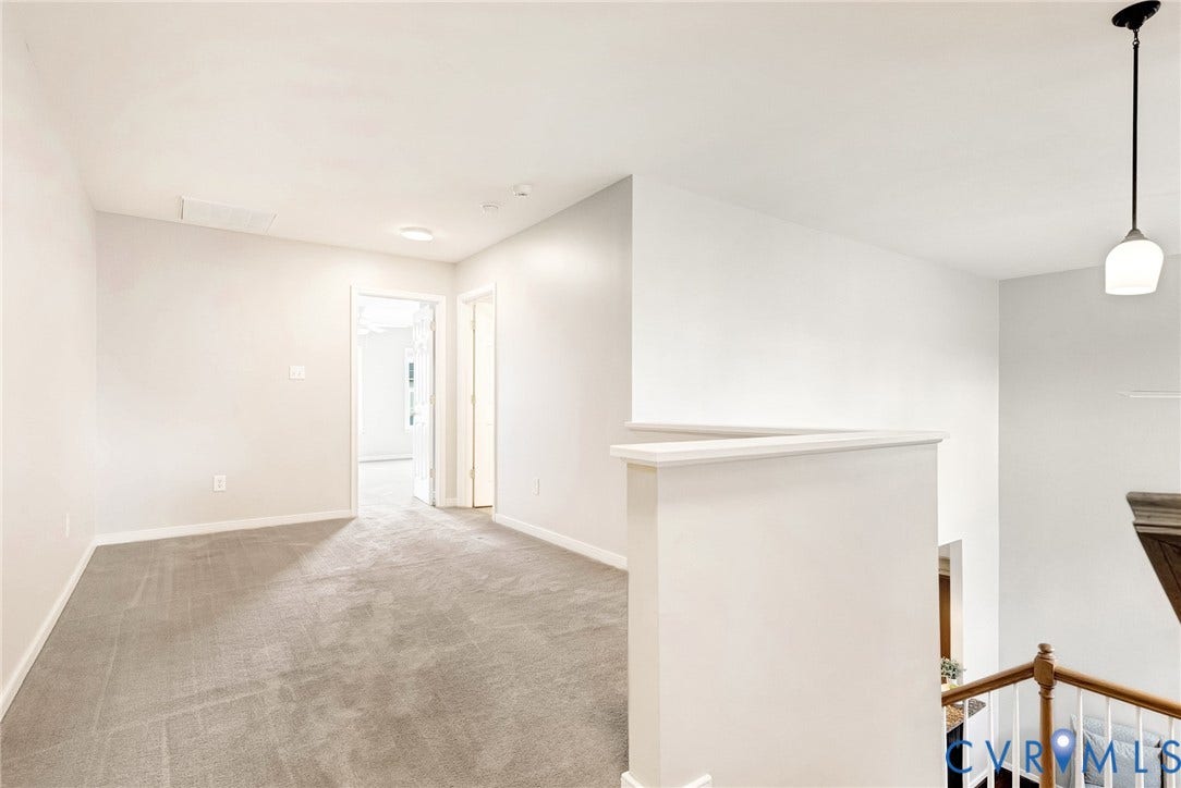 7728 Marshall Arch Drive, Liberty Trace, Mechanicsville, VA 23111 Carpeted flooring throughout, recessed lighting, white walls, and a suspended pendant light