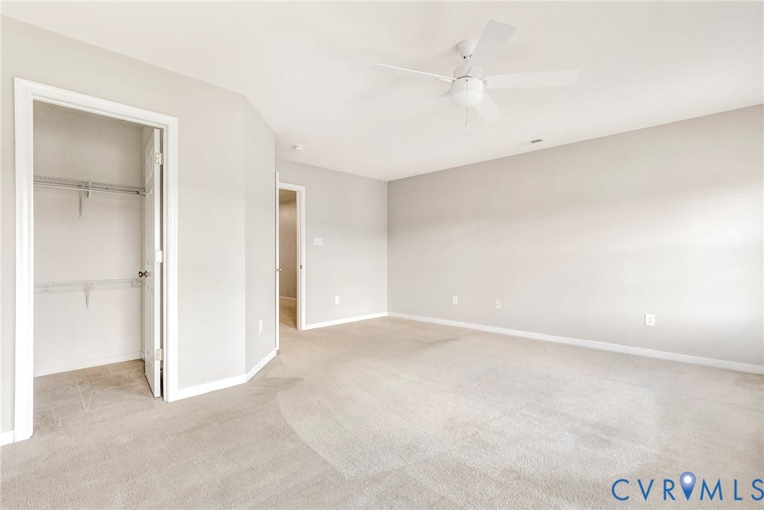 7728 Marshall Arch Drive, Liberty Trace, Mechanicsville, VA 23111 Neutral wall paint, plush carpet flooring, ceiling fan, and wire shelving in a built-in closet