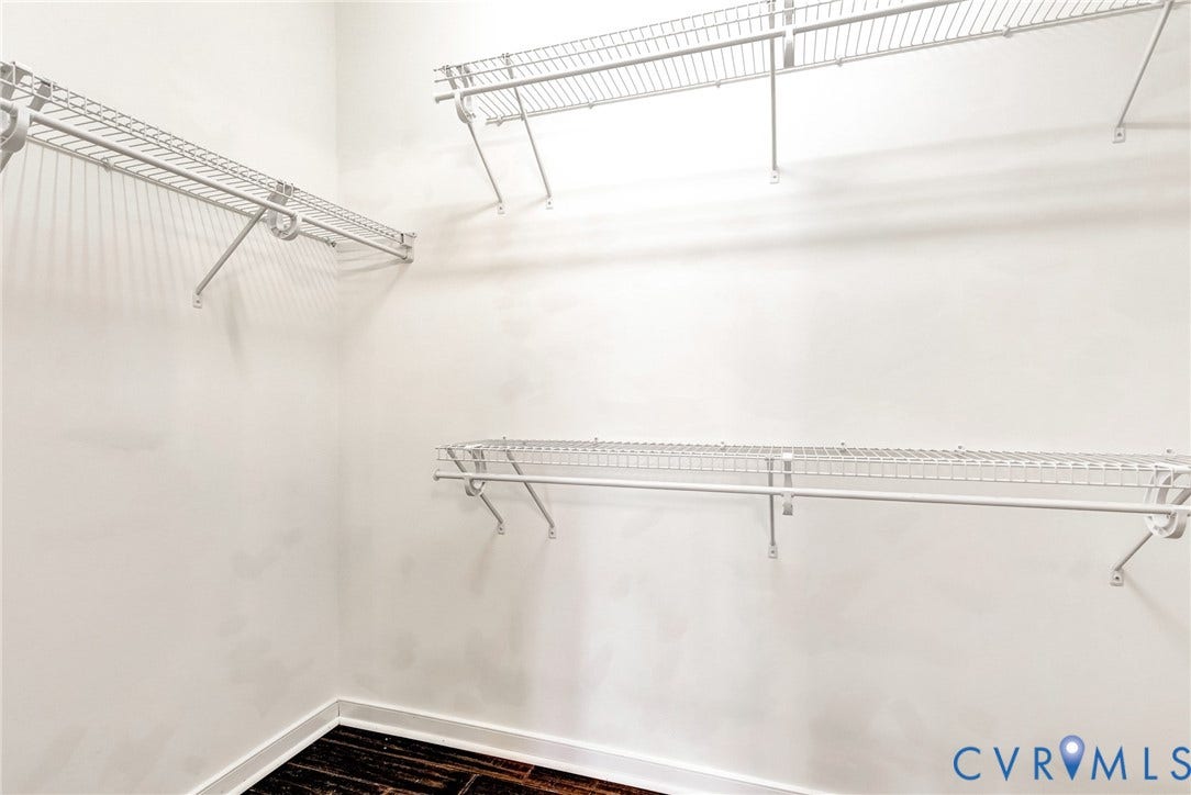 7728 Marshall Arch Drive, Liberty Trace, Mechanicsville, VA 23111 Integrated wire shelving system with multiple storage levels and dark wood-finish flooring