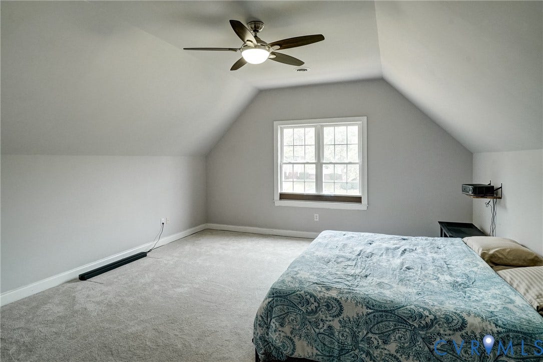 8805 Eli Place, Kings Forest, Glen Allen, VA 23060 Sloped ceilings with a ceiling fan, carpeted flooring, and a double window with a wood-finish sill