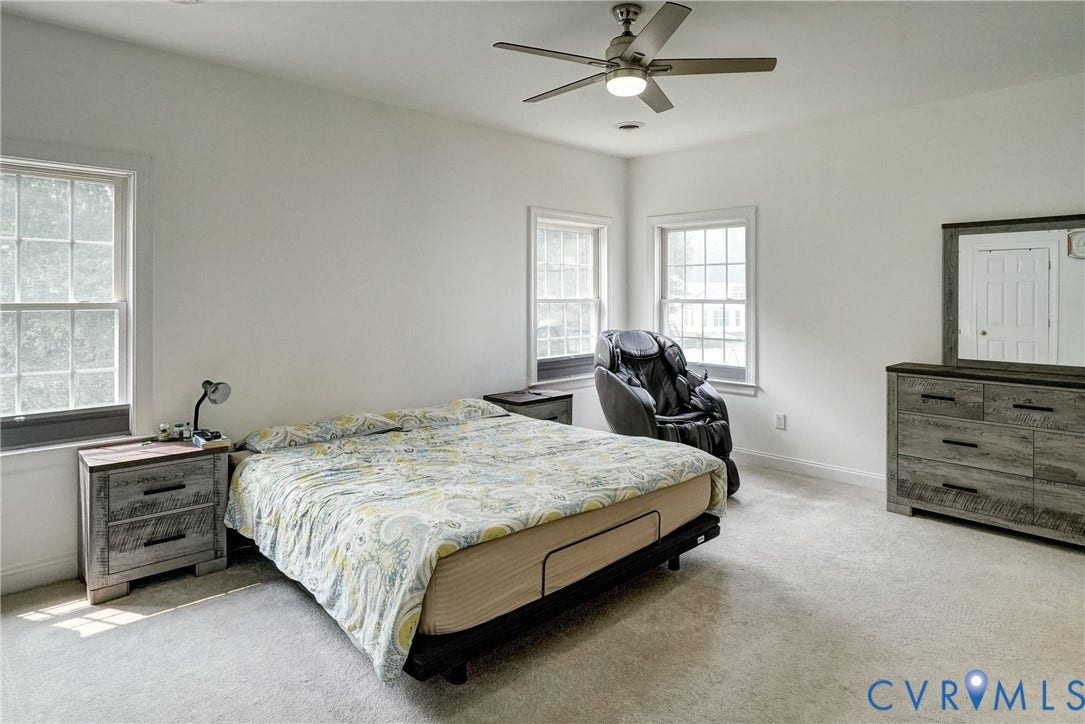 8805 Eli Place, Kings Forest, Glen Allen, VA 23060 White walls with two multi-pane windows and light-toned carpeting