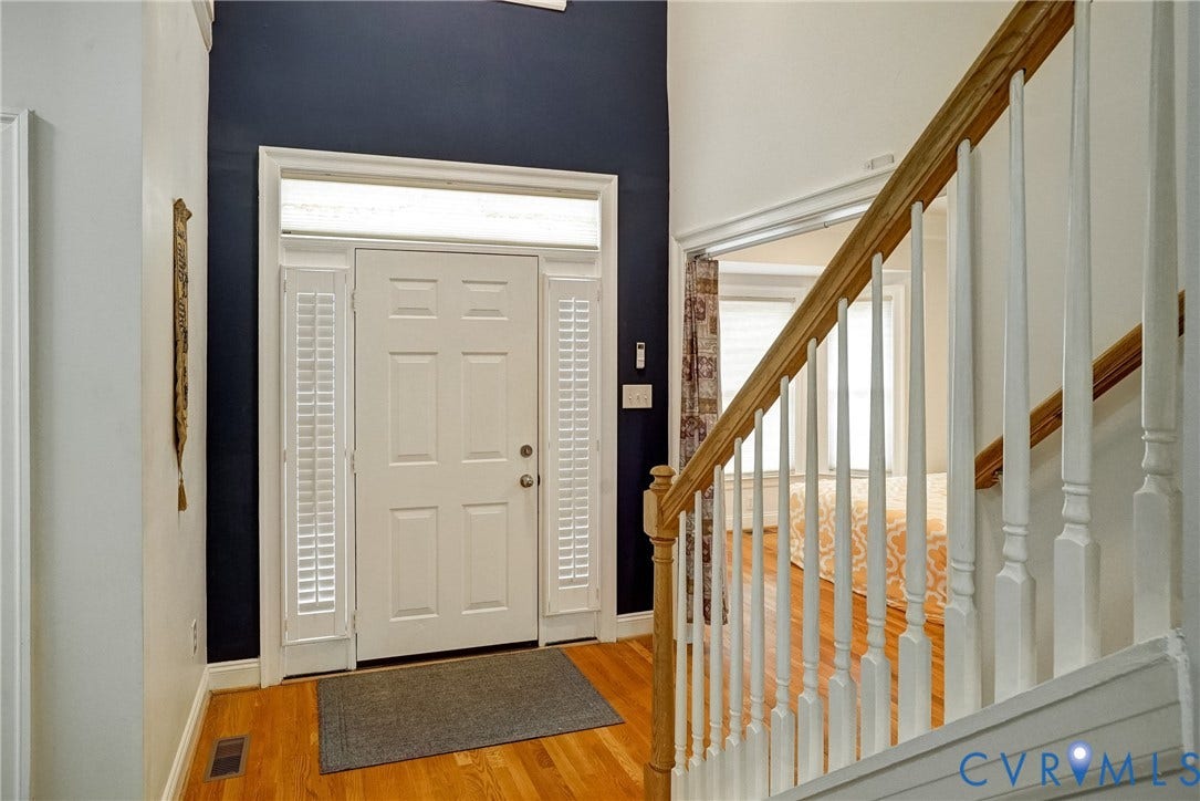 8805 Eli Place, Kings Forest, Glen Allen, VA 23060 Front entry with a paneled door, transom window, and sidelights