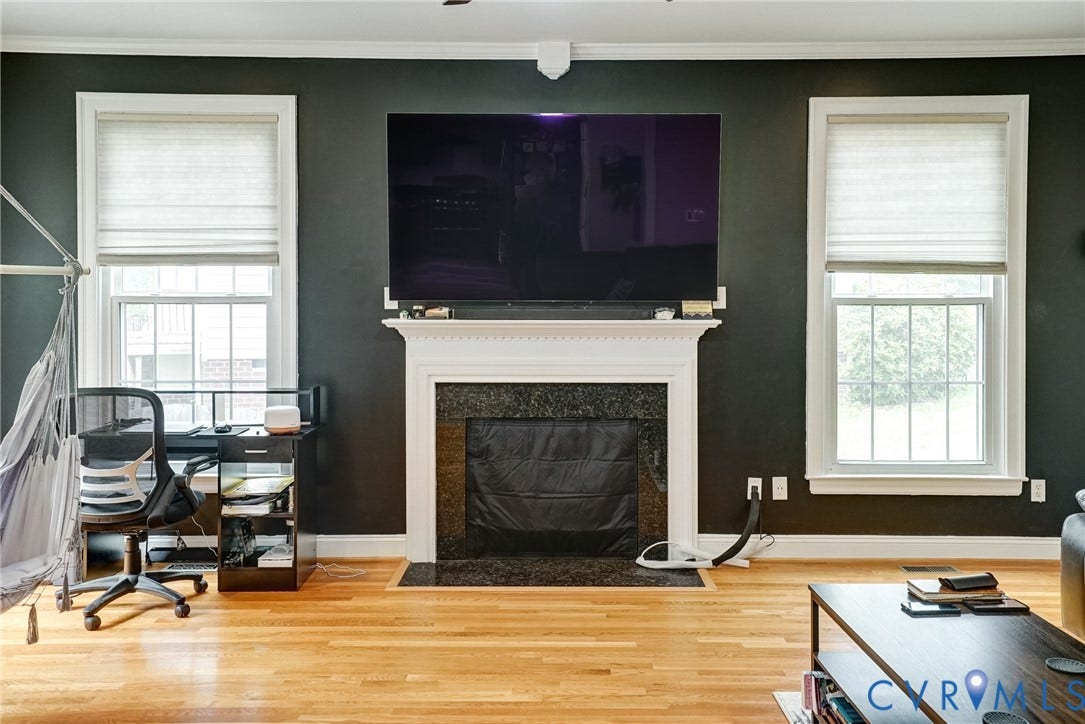 8805 Eli Place, Kings Forest, Glen Allen, VA 23060 Hardwood flooring with a decorative fireplace and white mantel