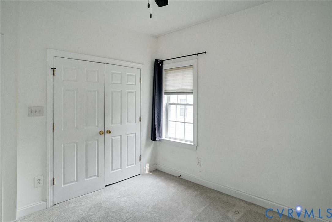 8805 Eli Place, Kings Forest, Glen Allen, VA 23060 Soft gray carpeting with white walls, featuring a paneled bi-fold closet door with brass hardware
