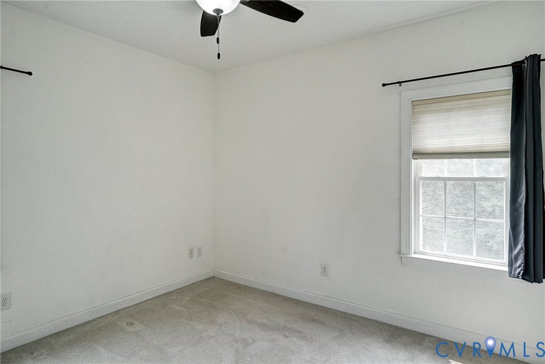 8805 Eli Place, Kings Forest, Glen Allen, VA 23060 Recessed window with white trim, a ceiling fan, and light gray wall-to-wall carpeting