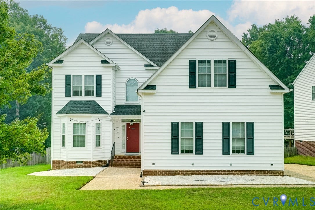 8805 Eli Place, Kings Forest, Glen Allen, VA 23060 White siding exterior with dark shutters, gabled rooflines, and a prominent red entry door